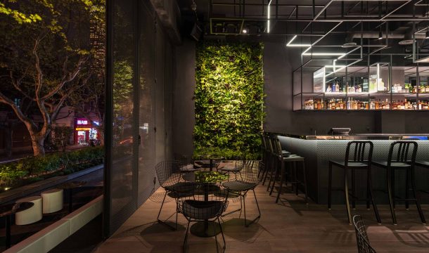 modern bar with black interior in shanghai, called The Botanist 2