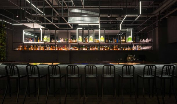 modern bar with black interior and extraordinary lighting in shanghai, called The Botanist