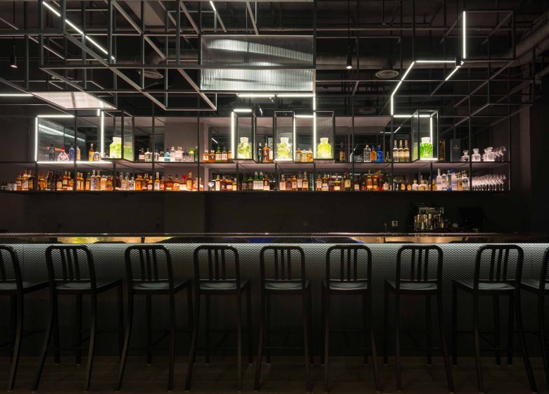 modern bar with black interior and extraordinary lighting in shanghai, called The Botanist